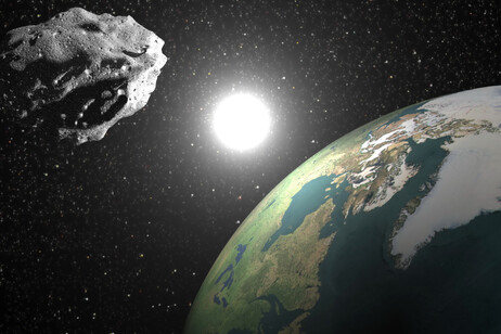 Rappresentazione artistica del passaggio ravvicinato di un asteroide (fonte: GoodFon)